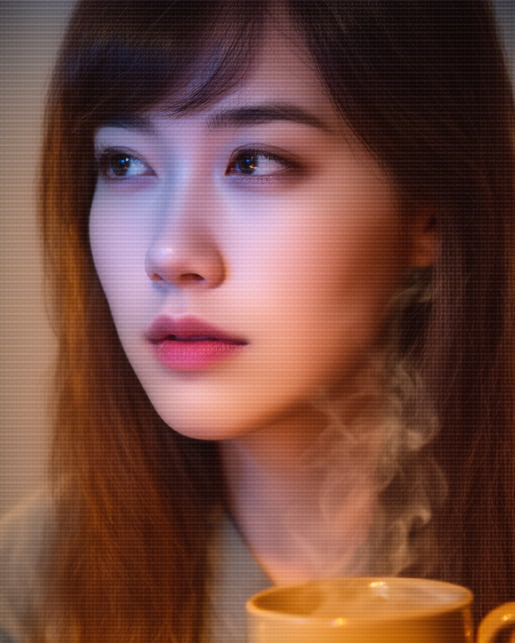 Ishi in warm amber light, late-night workspace